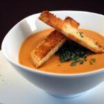 Velvety Tomato Bisque Paired with Crispy Grilled Cheese Croutons