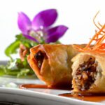 Crispy Duck Confit Spring Rolls with Tangy Plum Gastrique
