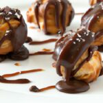 Decadent Chocolate-Dipped Profiteroles with Salted Caramel Drizzle