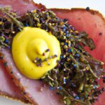 Savory Coppa Meets Zesty Pickled Mustard Seeds Delight